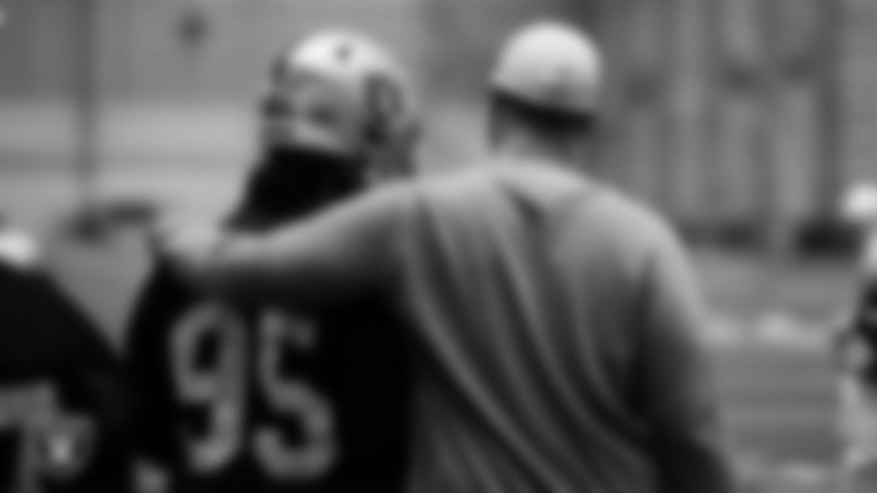 Las Vegas Raiders defensive end Kendal Vickers (95) and assistant offensive line coach Cameron Clemmons during practice at Intermountain Healthcare Performance Center.