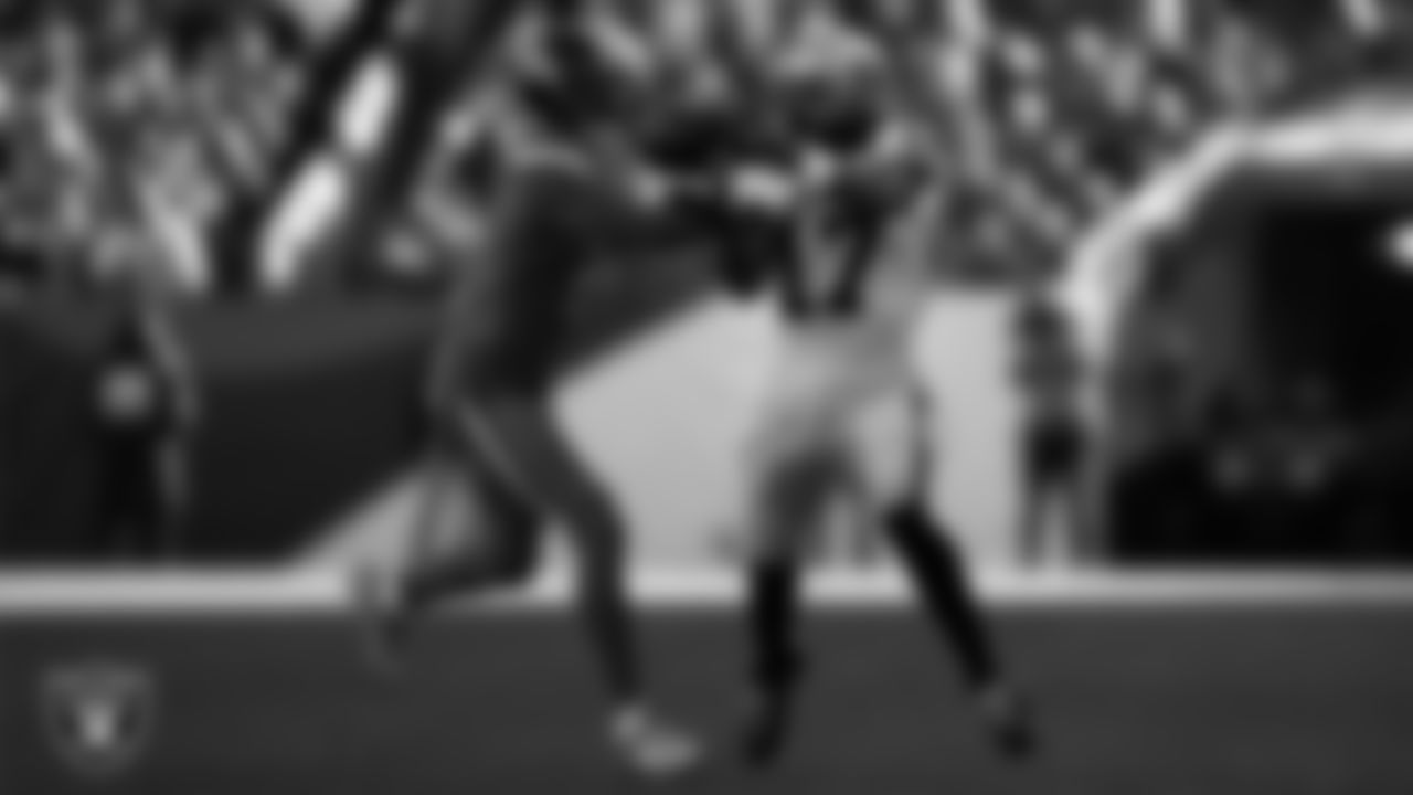 Las Vegas Raiders wide receiver Davante Adams (17) makes a catch during the regular season away game against the Denver Broncos at Empower Field at Mile High.