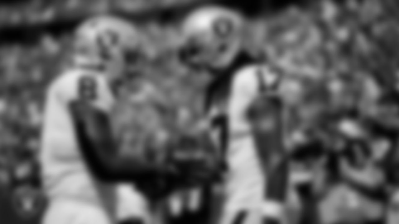 Las Vegas Raiders wide receiver Davante Adams (17) celebrates with running back Josh Jacobs (8) after making a 16-yard touchdown catch during the regular season away game against the Buffalo Bills at Highmark Stadium.