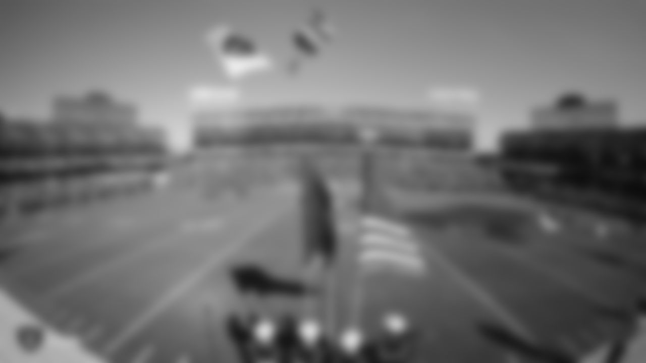 Frog-X Parachute Team parachutes into Oakland-Alameda County Coliseum before the Raiders regular season game against the Cincinnati Bengals.
