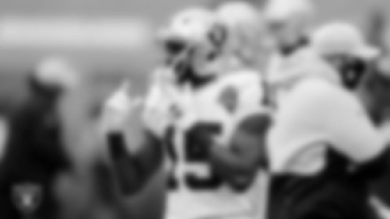 The Raiders warm up before the regular season game against the Cleveland Browns at FirstEnergy Stadium.