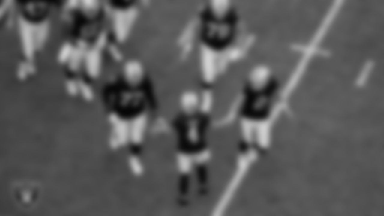 Las Vegas Raiders tackle Thayer Munford Jr. (77), quarterback Derek Carr (4) and kicker Daniel Carlson (2) during the regular season home game against the Arizona Cardinals at Allegiant Stadium.