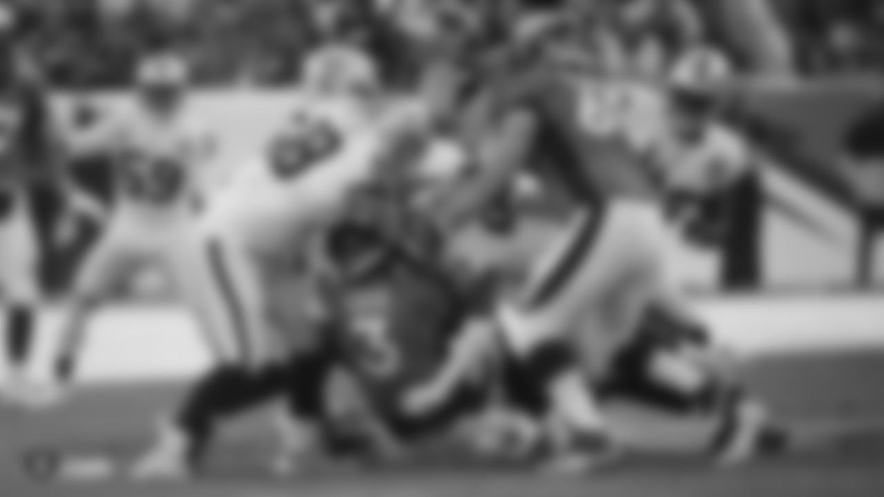 The Raiders during the regular season game against the Denver Broncos at Empower Field at Mile High.