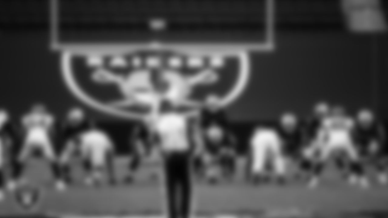 Las Vegas Raiders tackle Brandon Parker (75), guard John Simpson (76), center Rodney Hudson (61), quarterback Derek Carr (4), tackle Denzelle Good (71), running back Jalen Richard (30) and tackle Kolton Miller (74) line up before the snap during the regular season home game against the Tampa Bay Buccaneers.
