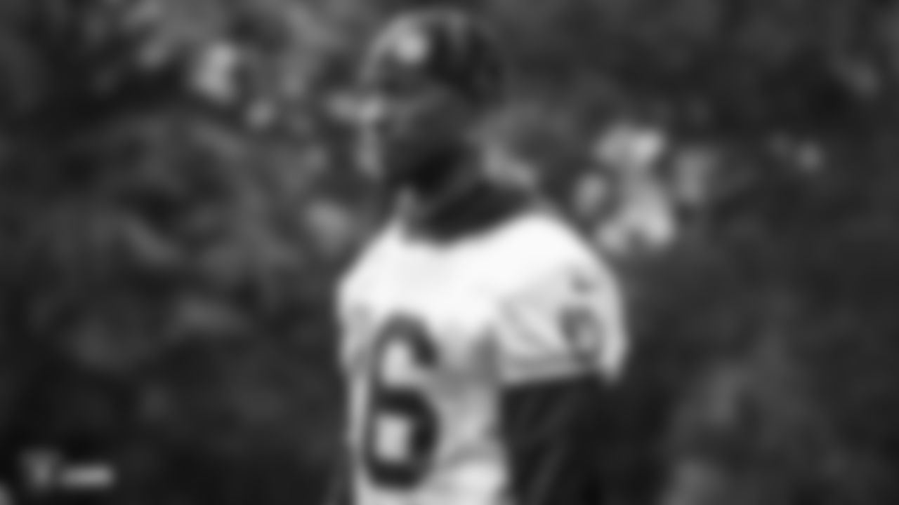 Raiders cornerback Nevin Lawson (26) stands on the field during practice.