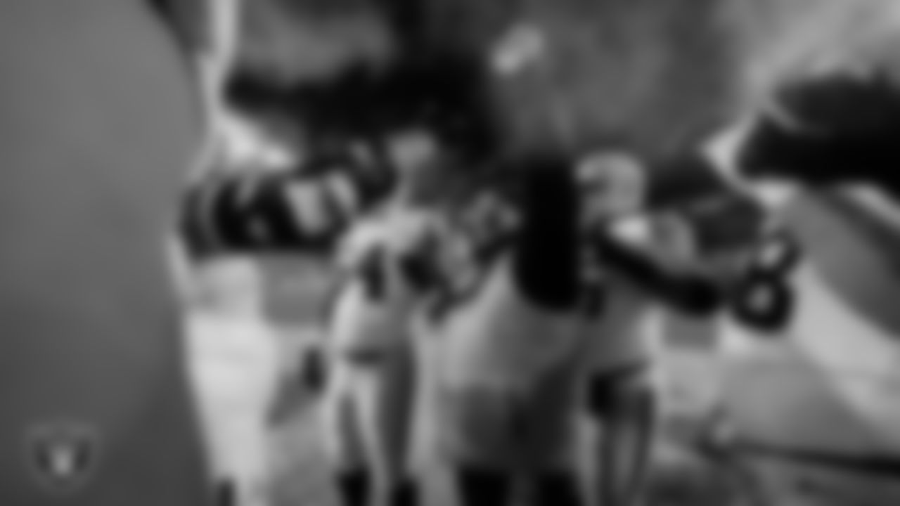 Las Vegas Raiders offensive line coach Carmen Bricillo huddles with the offensive line during warm ups before the regular season away game against the Pittsburgh Steelers at Acrisure Stadium.