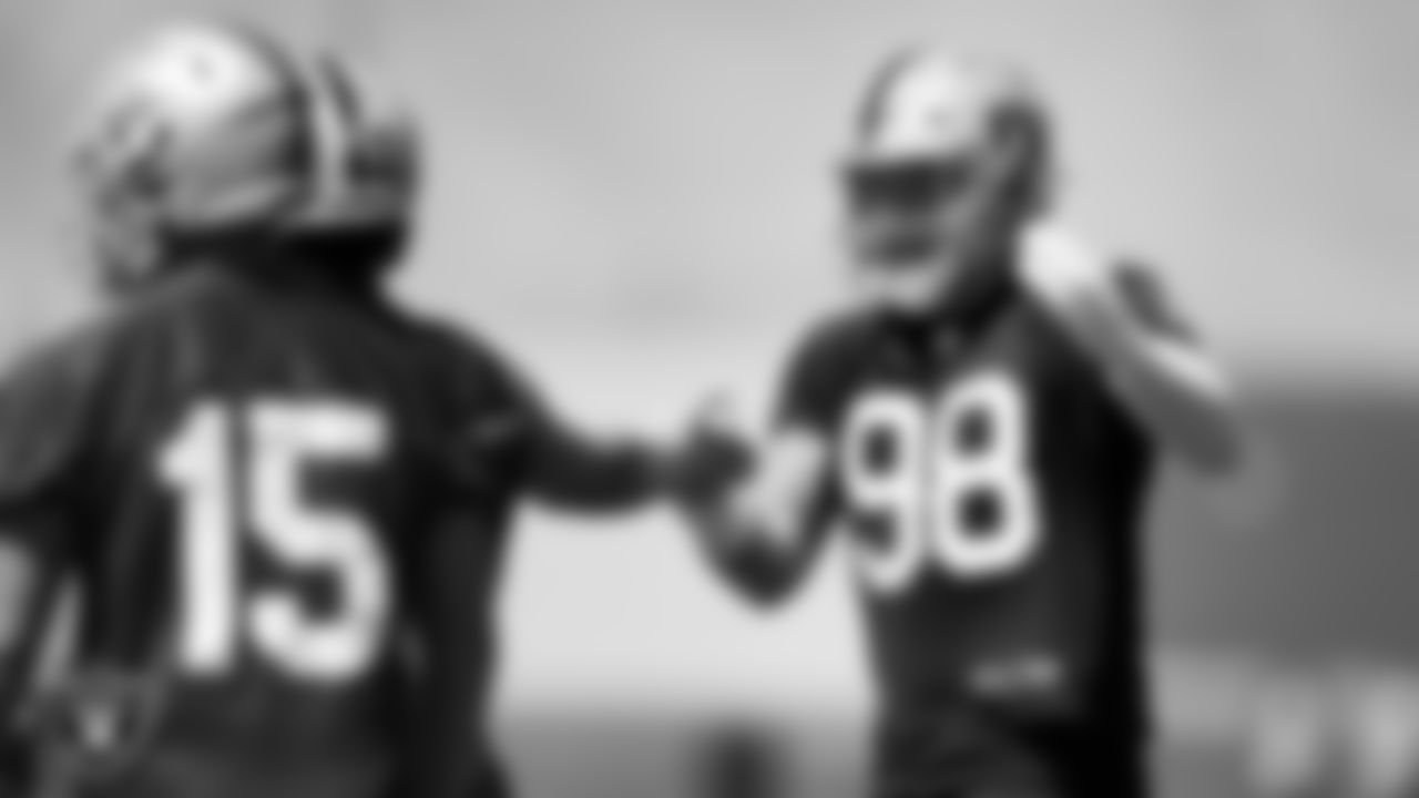 Las Vegas Raiders quarterback Derek Carr (4) and defensive end Maxx Crosby (98) at an Organized Team Activity (OTA).