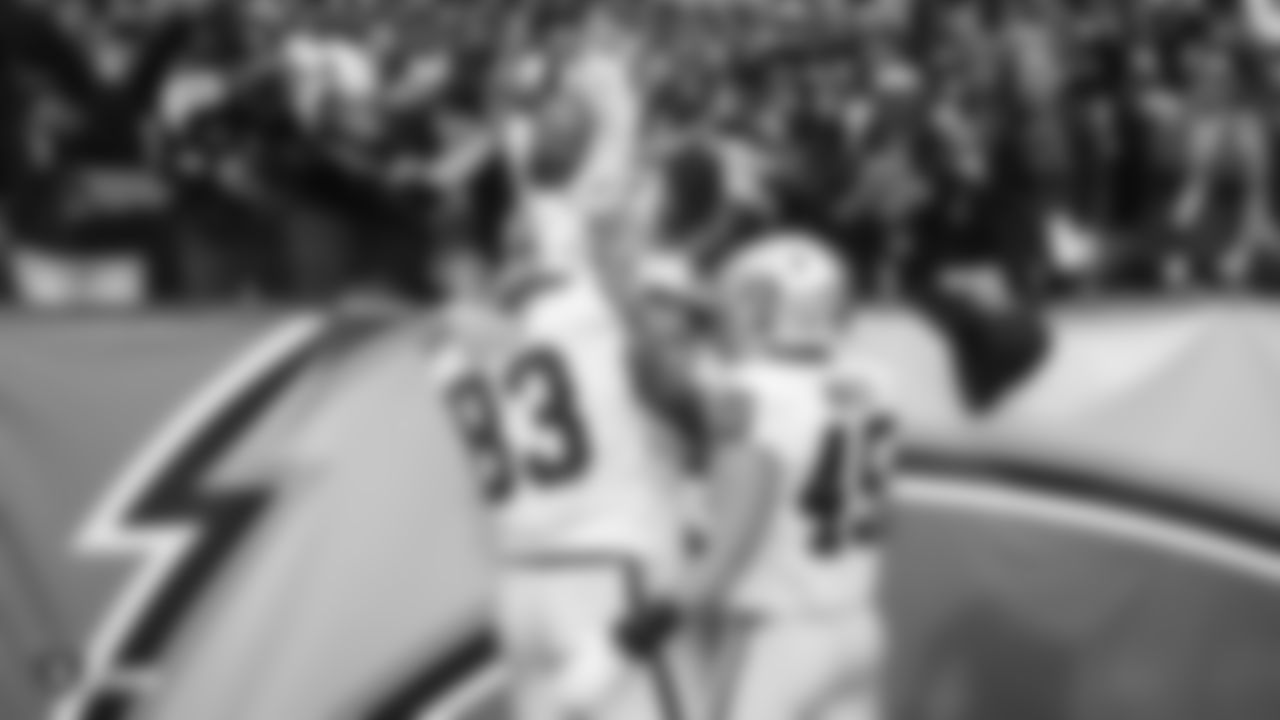 Raiders quarterback Derek Carr (4) celebrates with tight end Darren Waller (83) and fullback Alec Ingold (45) after rushing for a 3-yard touchdown during the regular season game against the Los Angeles Chargers.