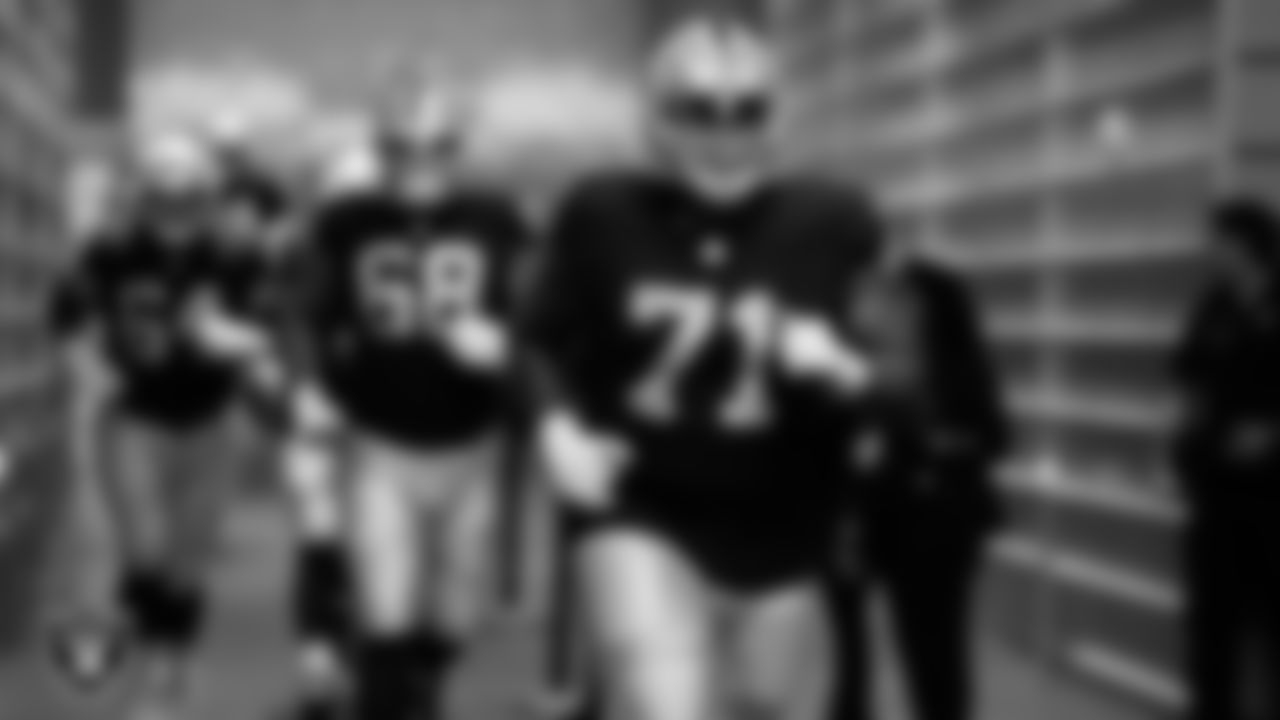 Las Vegas Raiders tackle Justin Herron (71) walks down the tunnel before the preseason away game against the Dallas Cowboys at AT&T Stadium.
