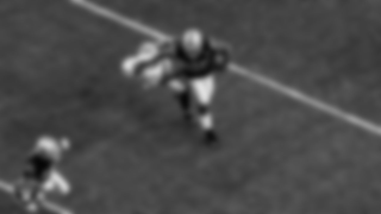 Las Vegas Raiders running back Josh Jacobs (28) stiff arms the defender during the regular season home game against the Indianapolis Colts.