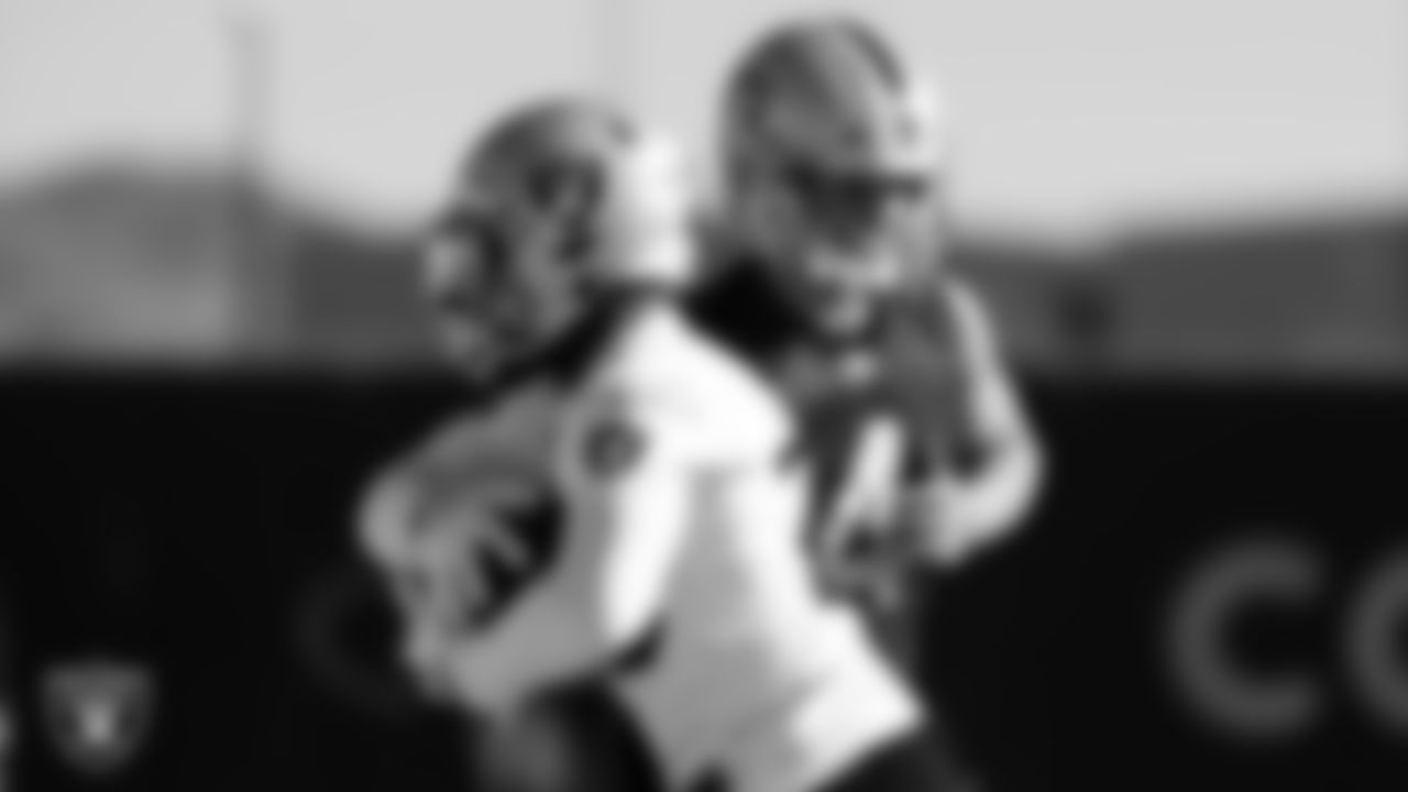 Las Vegas Raiders quarterback Derek Carr (4) and running back Josh Jacobs (28) during practice at Intermountain Healthcare Performance Center.
