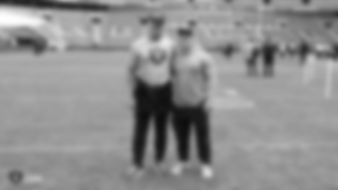Oakland Raiders head coach Jon Gruden and his son and strength and conditioning assistant Deuce Gruden on the field for a walk through before their game against the Seattle Seahawks, Saturday, October 13, 2018, in London, England.