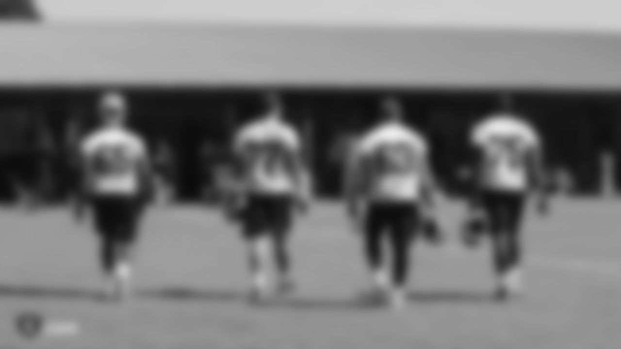 Oakland Raiders offensive guard Jordan Simmons (65), offensive tackle Kolton Miller (77), center Cameron Hunt (63), and offensive tackle Brandon Parker (75) on the field for practice at 2018 Pre-Training Camp at The Oakland Raiders Napa Valley Training Complex, Tuesday, July 24, 2018, in Napa, California.