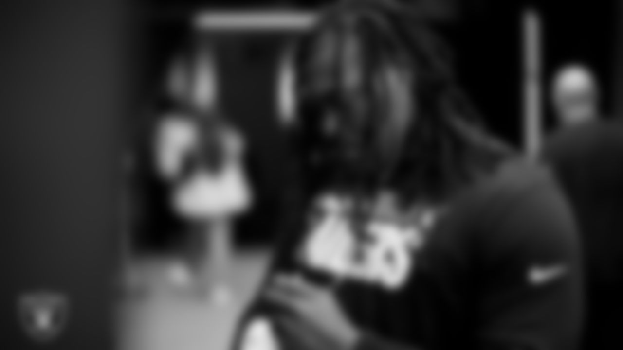 Las Vegas Raiders defensive tackle Darius Philon (96) signs autographs for fans before the regular season home game against the Miami Dolphins.