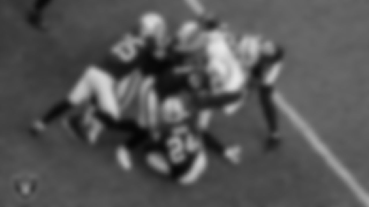 The Las Vegas Raiders defense makes a tackle during the regular season home game against the Chicago Bears.