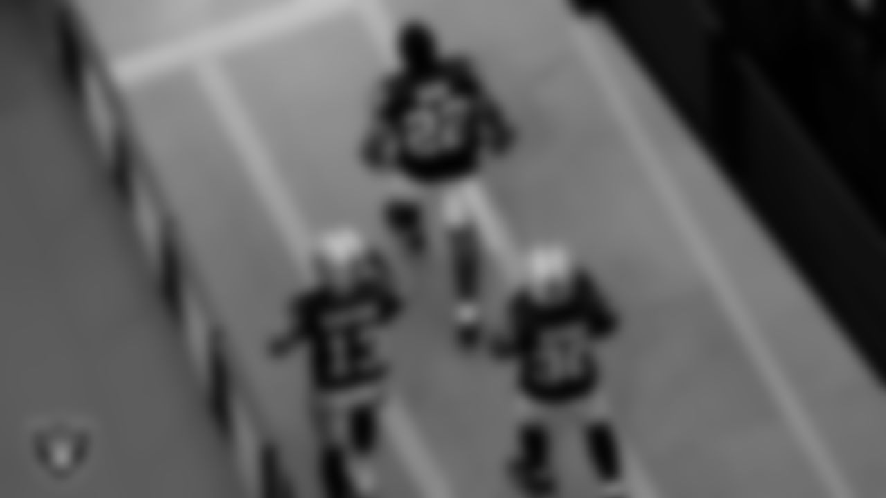 The Raiders walk down the tunnel before the regular season game against the Denver Broncos at Allegiant Stadium.