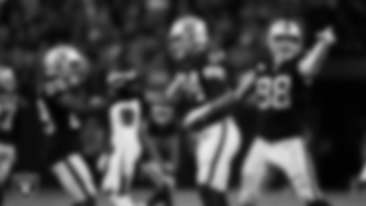 Las Vegas Raiders defensive end Carl Nassib (94) celebrates with cornerback Casey Hayward Jr. (29) after forcing a fumble during the regular season home game against the Baltimore Ravens.