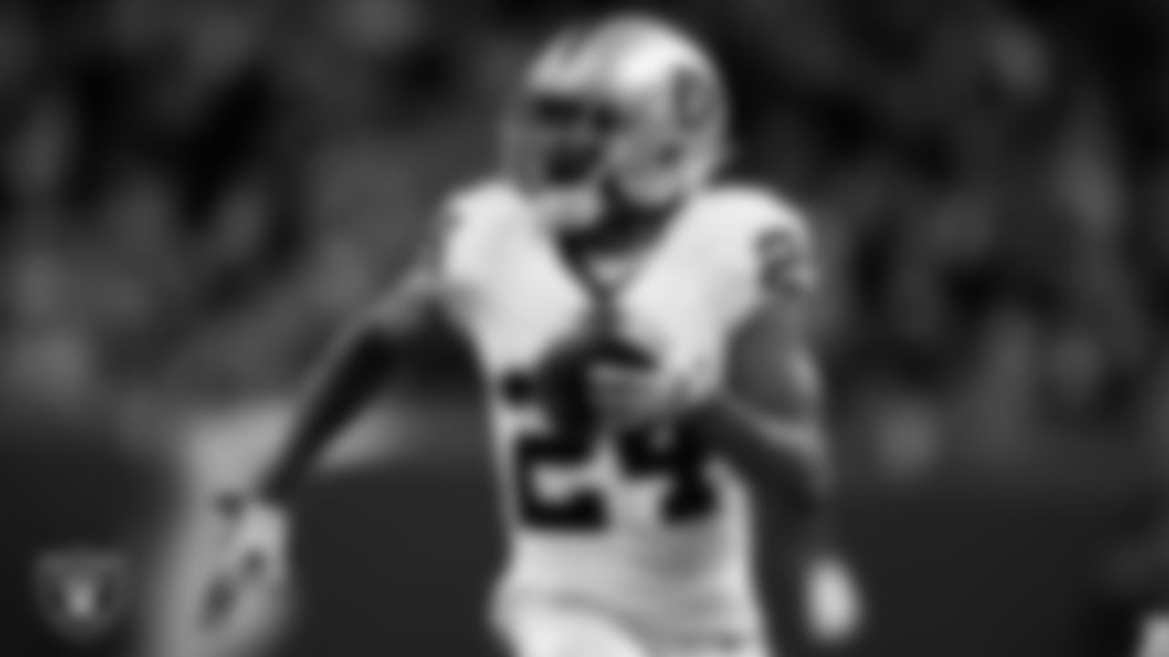 Las Vegas Raiders cornerback Marcus Peters (24) returns an interception for a 75-yard touchdown during the regular season away game against the Detroit Lions at Ford Field.