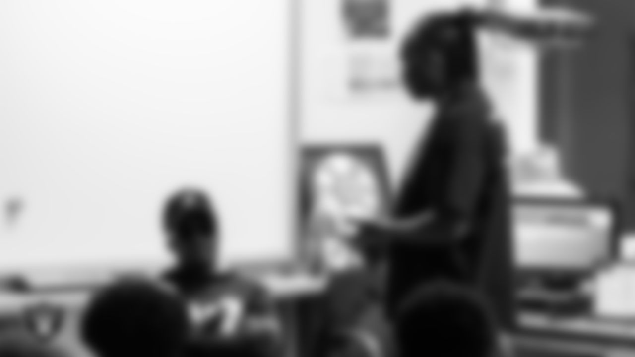 Teacher Robert Strawder asks Las Vegas Raiders cornerback Sam Webb (27) about his clothing style and hip hop brands during the the Hip Hop Entrepreneurship class.