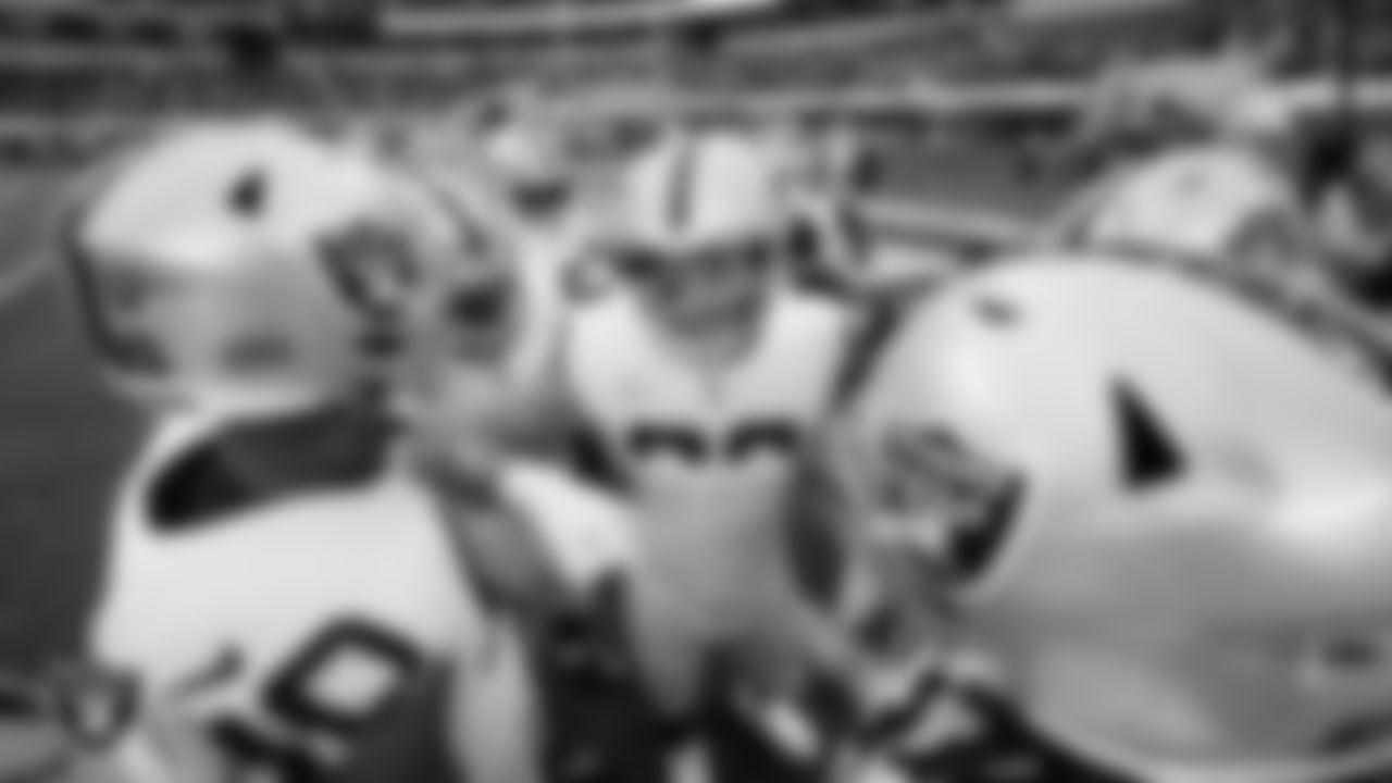 The Las Vegas Raiders huddle before the regular season away game against the Los Angeles Chargers at SoFi Stadium.