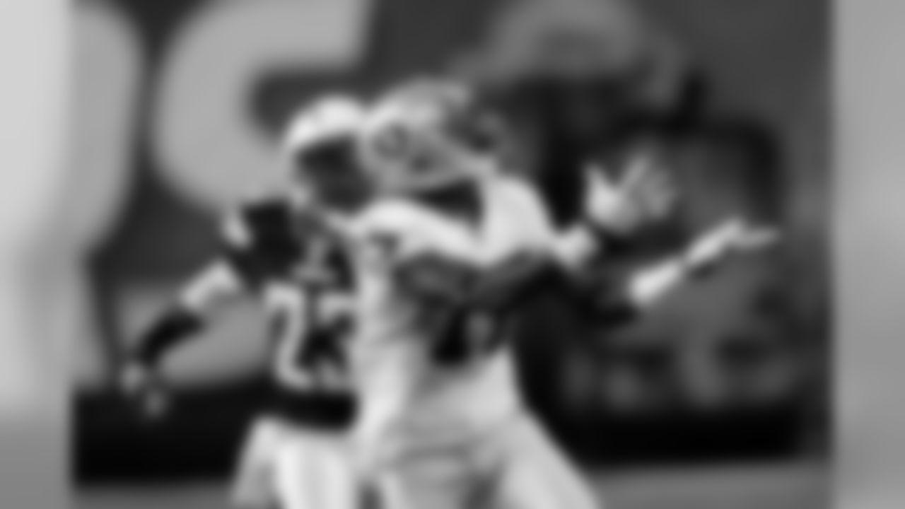 WR Denarius Moore beats the defender up the middle and reaches out for the ball.