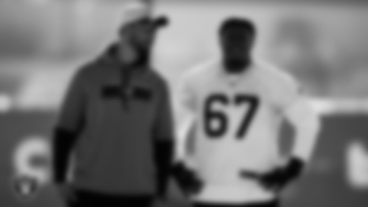 Las Vegas Raiders assistant offensive line coach Cameron Clemmons and guard Lester Cotton Sr. (67) during practice at Intermountain Healthcare Performance Center.