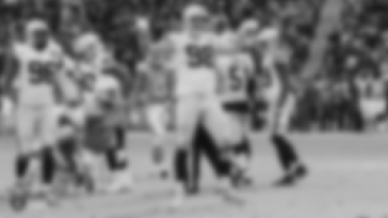 Raiders defensive end Maxx Crosby (98) celebrates after making a tackle during the regular season game against the Los Angeles Chargers.