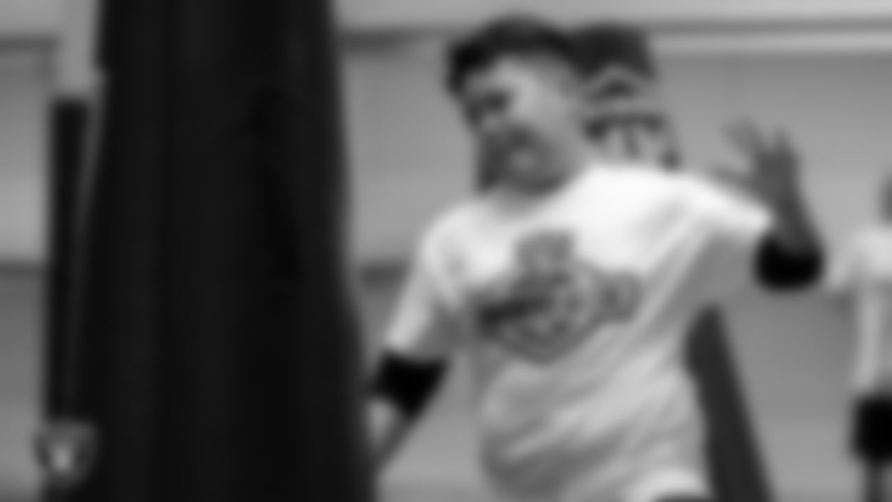 An athlete goes through a drill during the ELITE Academy at Las Vegas Raiders Headquarters.