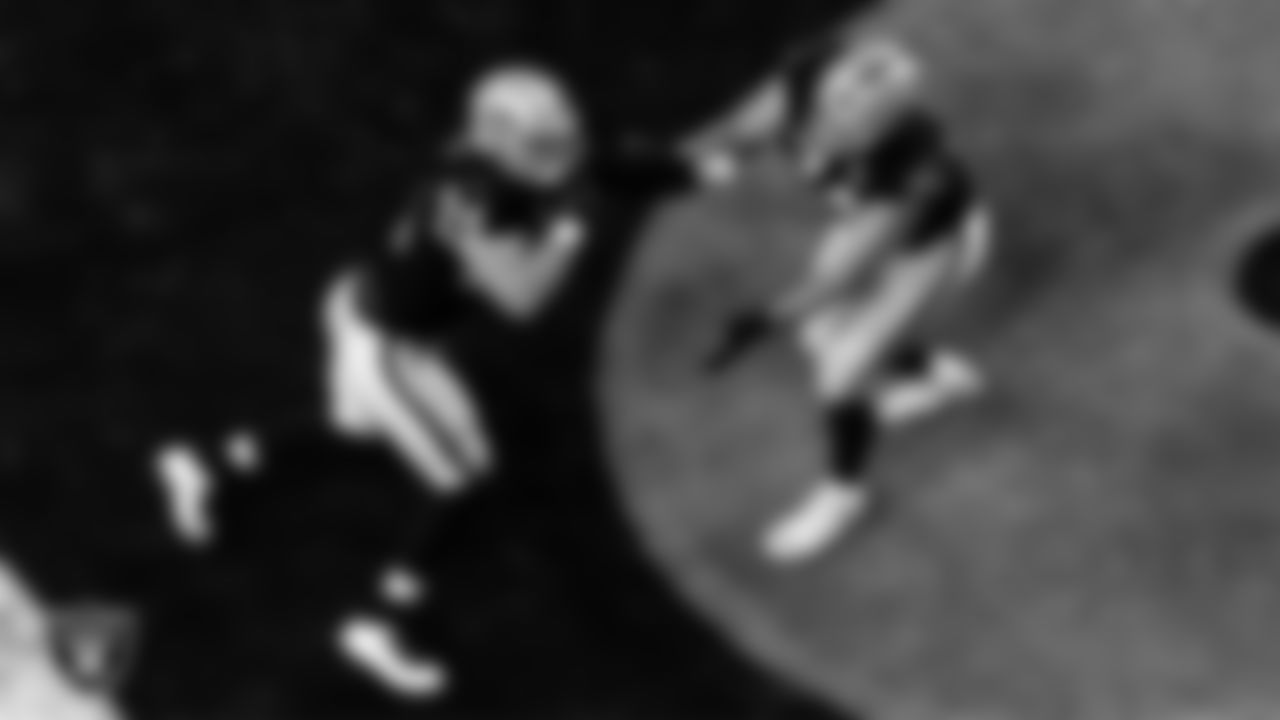Las Vegas Raiders defensive end Carl Nassib (94) and tackle Kolton Miller (74) warming up before the regular season home game against the Miami Dolphins.