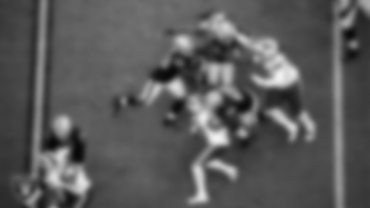 Las Vegas Raiders running back Josh Jacobs (28) rushes as center Rodney Hudson (61) and guard Gabe Jackson (66) block during the regular season home game against the Buffalo Bills.