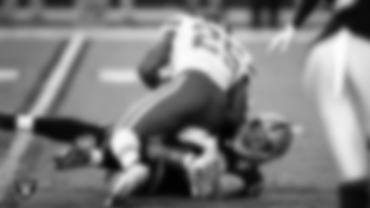 Las Vegas Raiders defensive end Maxx Crosby (98) makes a tackle during the regular season home game against the Kansas City Chiefs.