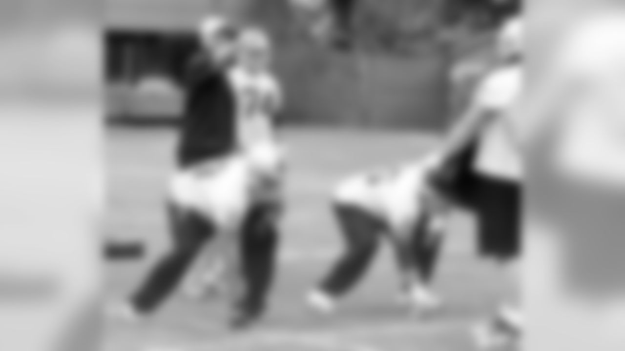 Offensive line coach Frank Pollack works with his position players.