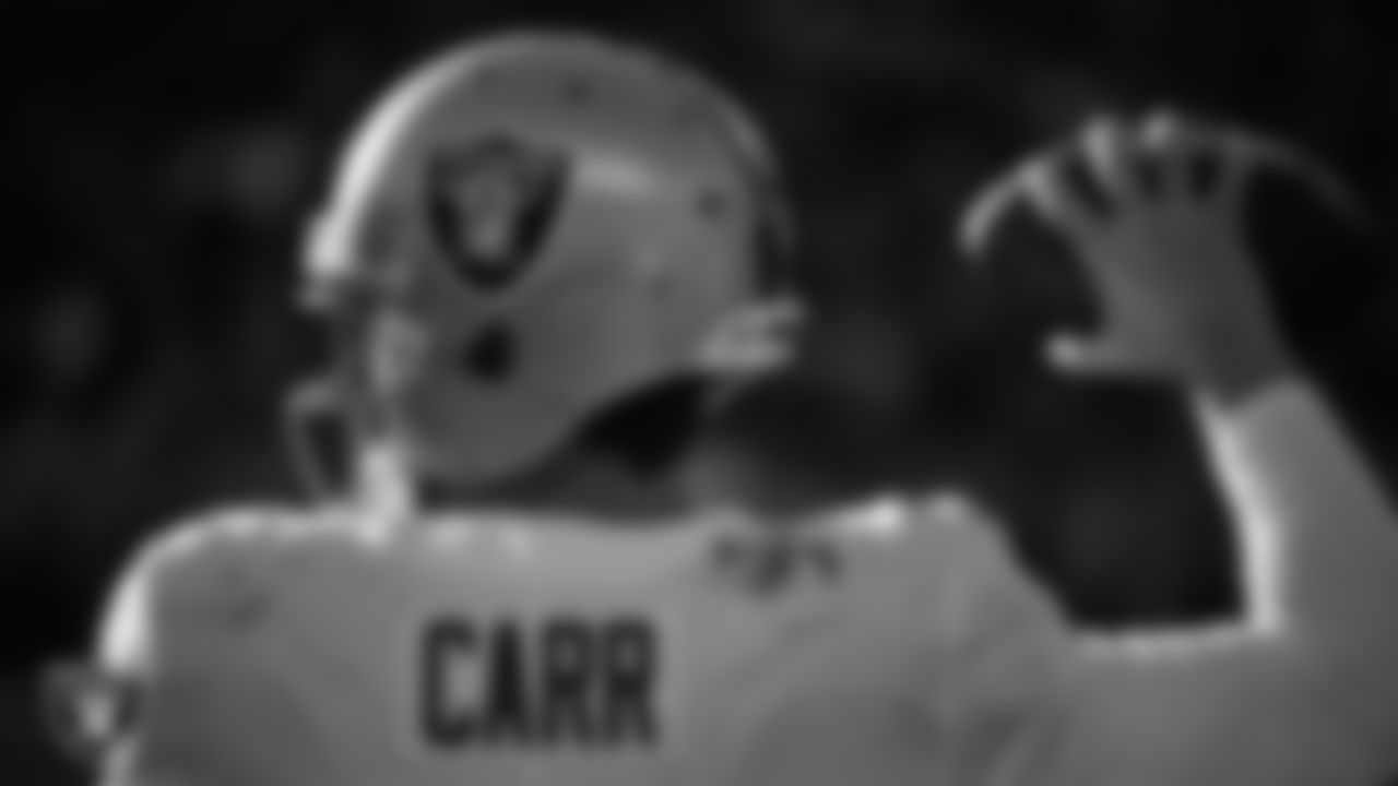 Las Vegas Raiders quarterback Derek Carr (4) on the sidelines during the regular season away game against the Denver Broncos at Empower Field at Mile High.