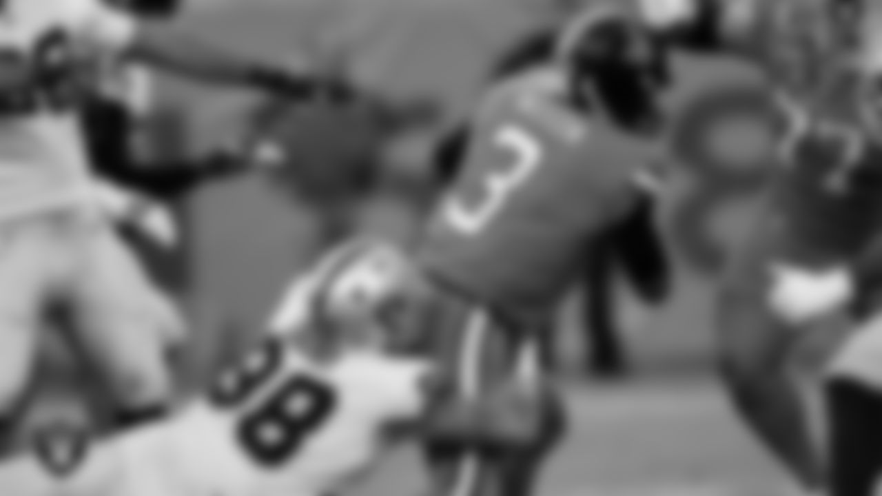 Las Vegas Raiders defensive end Maxx Crosby (98) sacks the quarterback during the regular season away game against the Denver Broncos at Empower Field at Mile High.