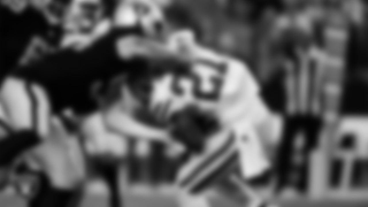 Las Vegas Raiders defensive end Maxx Crosby (98) makes a tackle during the regular season home game against the Green Bay Packers at Allegiant Stadium.