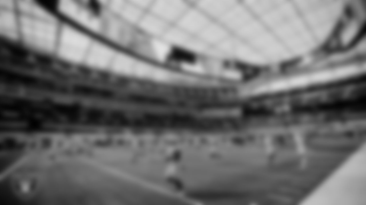 The Raiders warm up before the regular season game against the Los Angeles Chargers at SoFi Stadium.