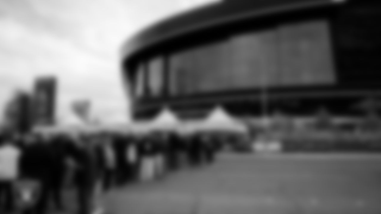 Season Ticket Holders line up outside of Allegiant Stadium before the appreciation event.