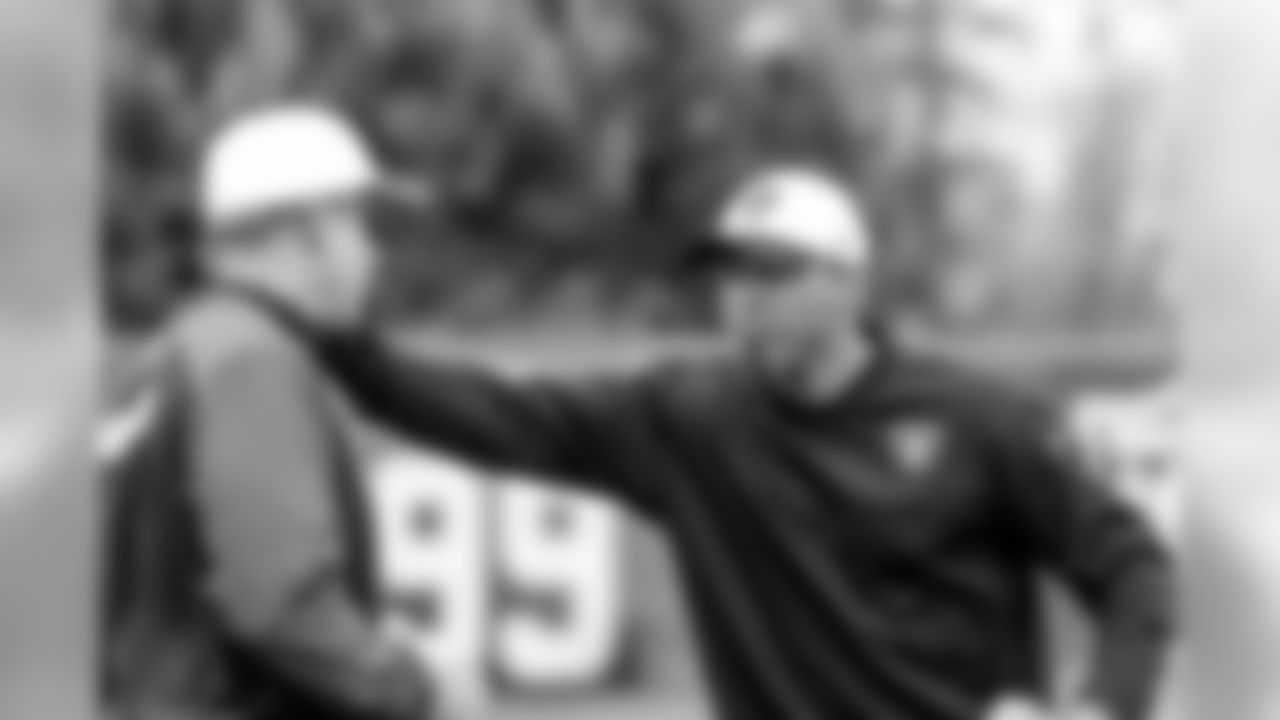 Head Coach Jack Del Rio and assistant defensive backs coach Rod Woodson