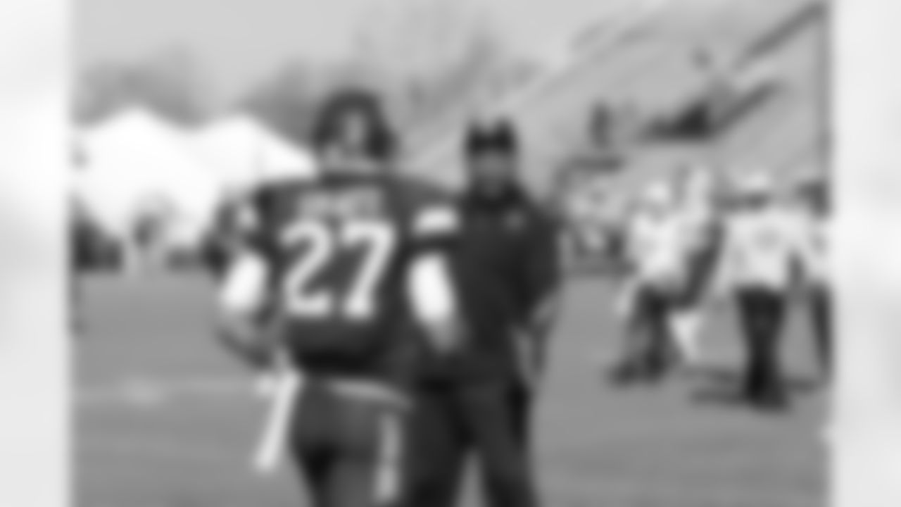 Defensive backs coach Johnnie Lynn coaches up UConn DB Dwayne Gratz after his rep.