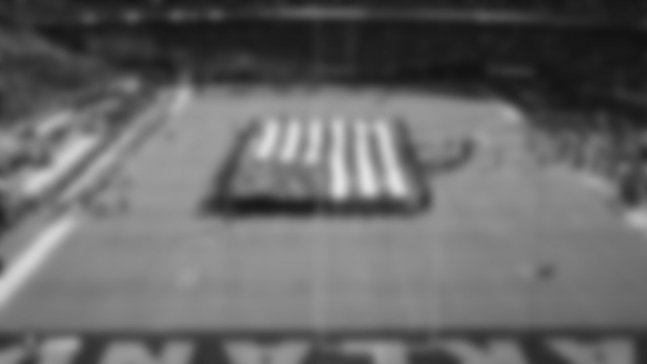 The American flag is displayed by season ticket members during the national anthem before the Raiders regular season game against the Jacksonville Jaguars.