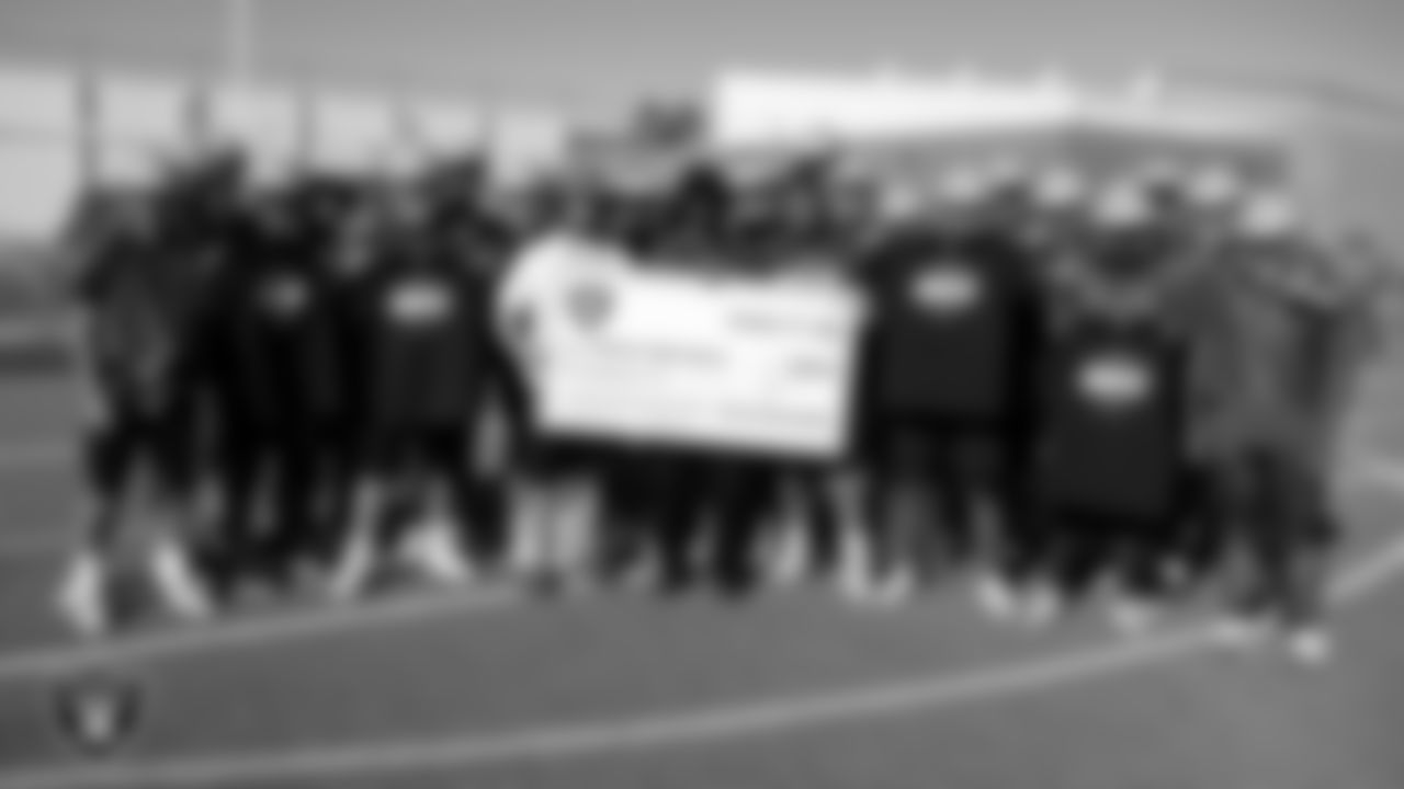 The Western High School football team poses for a photo after practice at Western High School.