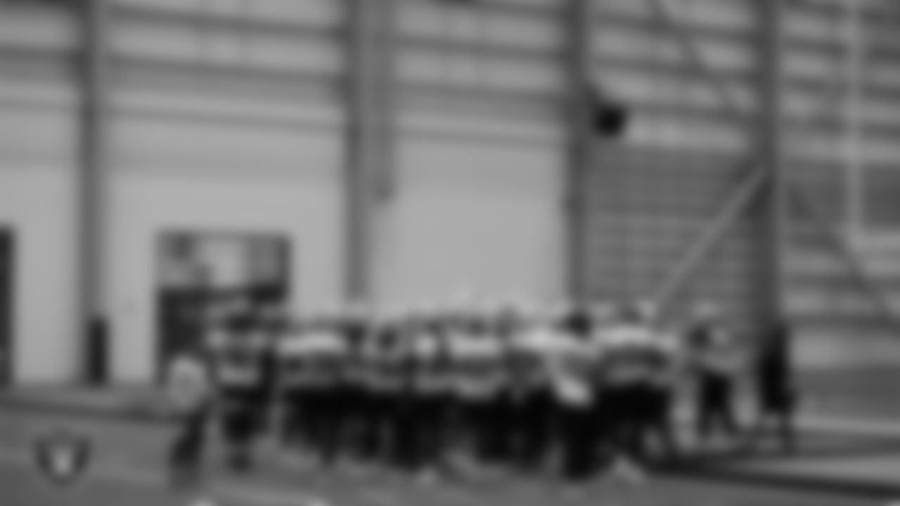 The Las Vegas Raiders huddle during practice at Intermountain Healthcare Performance Center.