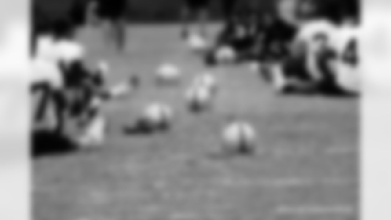 The players stretch during practice.
