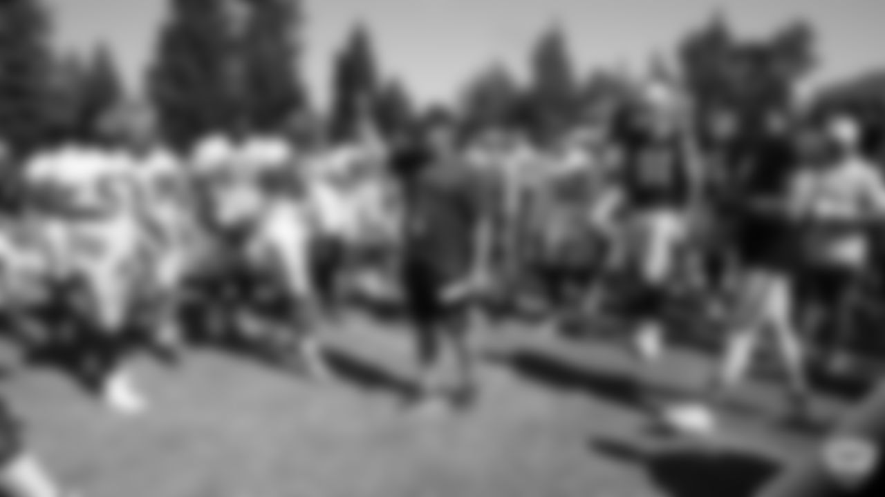 Raiders Head Coach Jon Gruden huddles up the team on the field for practice at 2019 Training Camp.