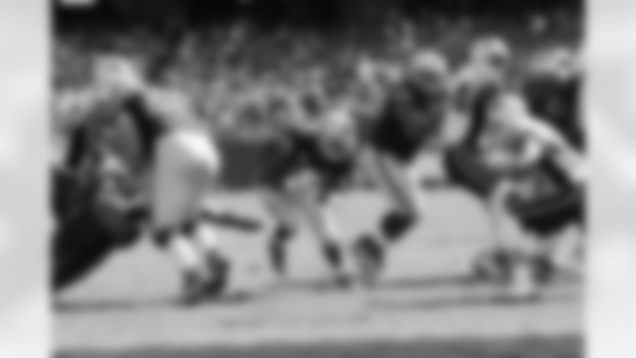 RB Darren McFadden finds the hole created by his offensive line.