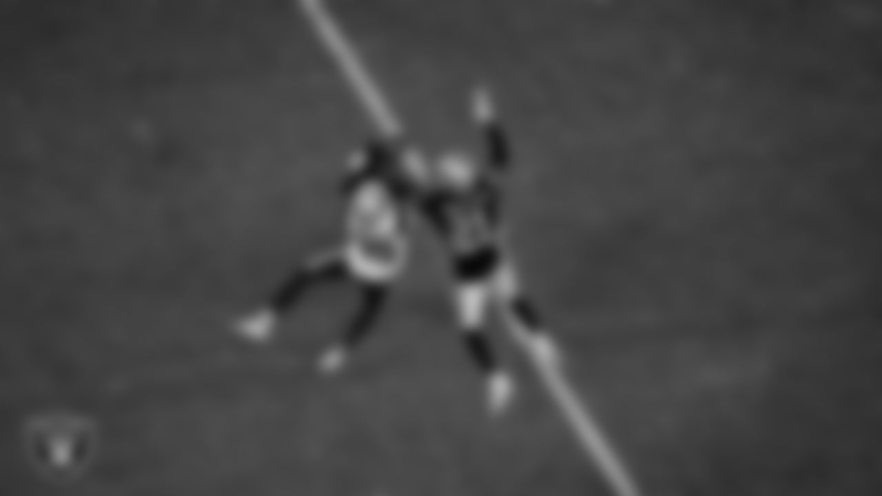 Las Vegas Raiders cornerback Amik Robertson (21) breaks up a pass during the regular season home game against the New England Patriots at Allegiant Stadium.