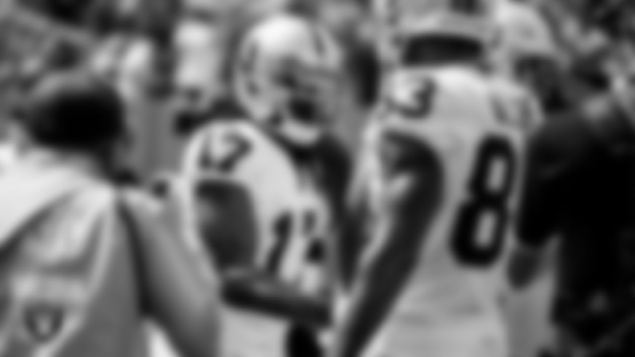 Las Vegas Raiders wide receiver Davante Adams (17) celebrates with teammates after making a 5-yard touchdown catch during the regular season away game against the Tennessee Titans at Nissan Stadium.