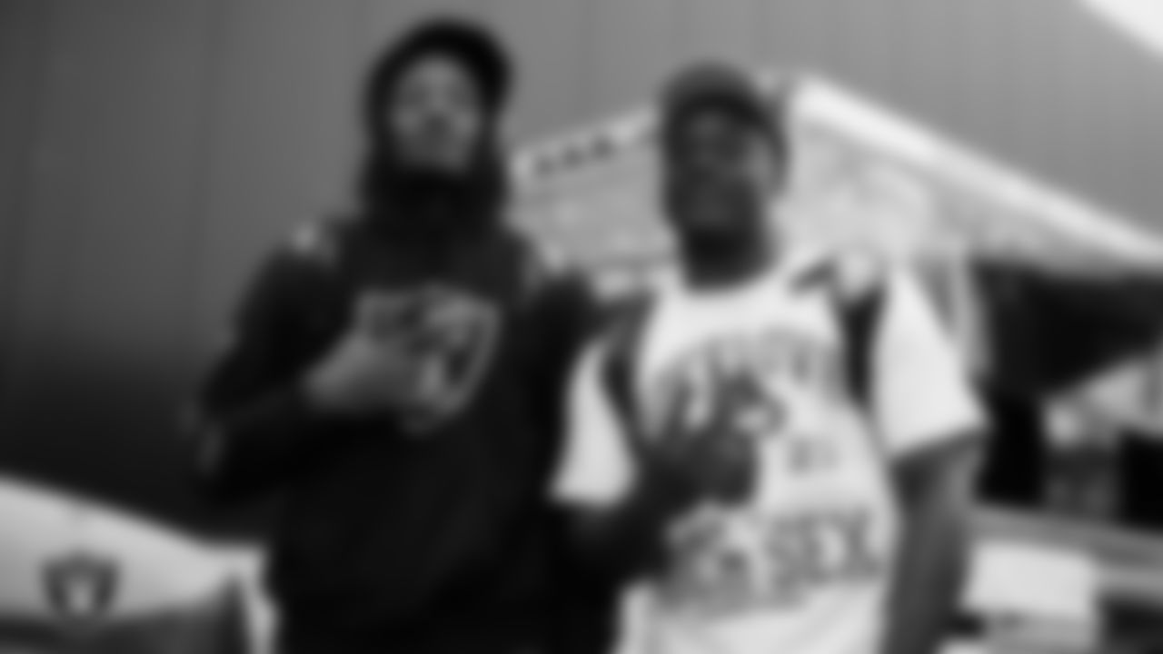 Las Vegas Raiders cornerback Sam Webb (27) and linebacker Darien Butler (58) enjoy food trucks after practice at Intermountain Health Performance Center.