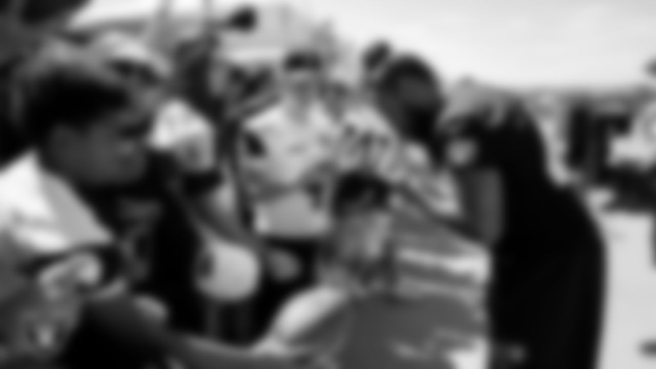 Las Vegas Raiders linebacker Kana'i Mauga (43) signs autographs for fans after practice at 2023 Training Camp at Intermountain Health Performance Center.