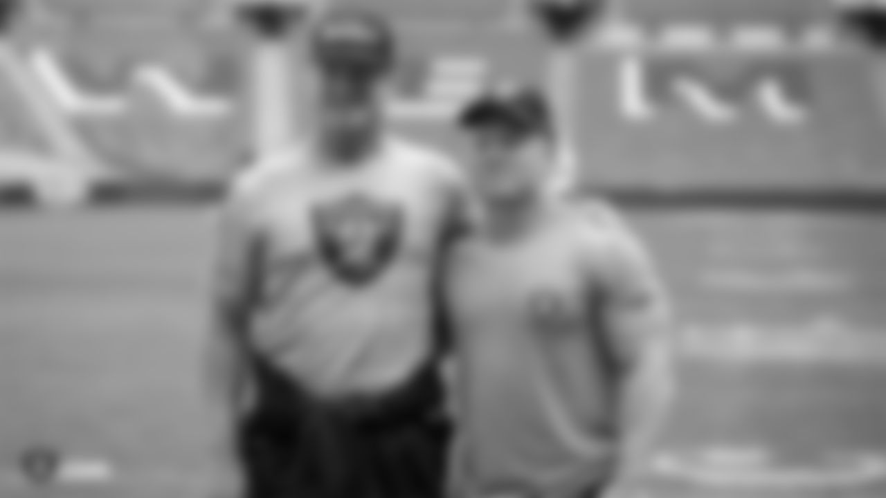 Oakland Raiders head coach Jon Gruden and strength and conditioning assistant Deuce Gruden on the field for a walk through before their game against the Seattle Seahawks, Saturday, October 13, 2018, in London, England.